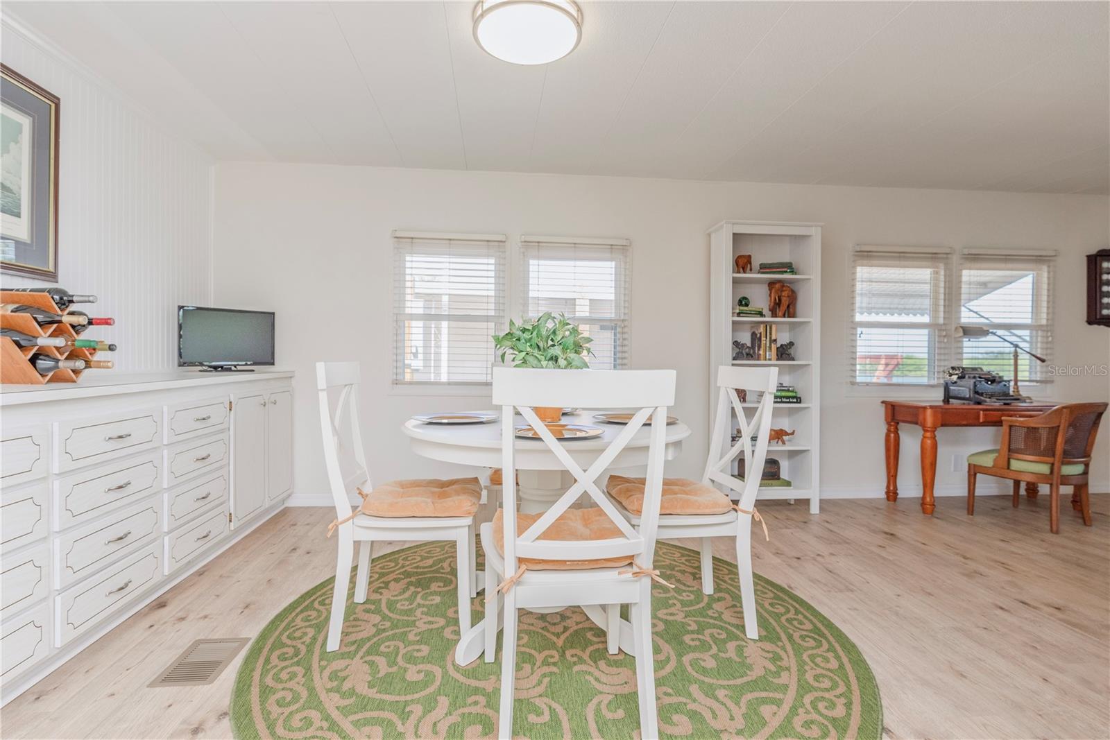 Dining room has built-in credenza for extra storage.
