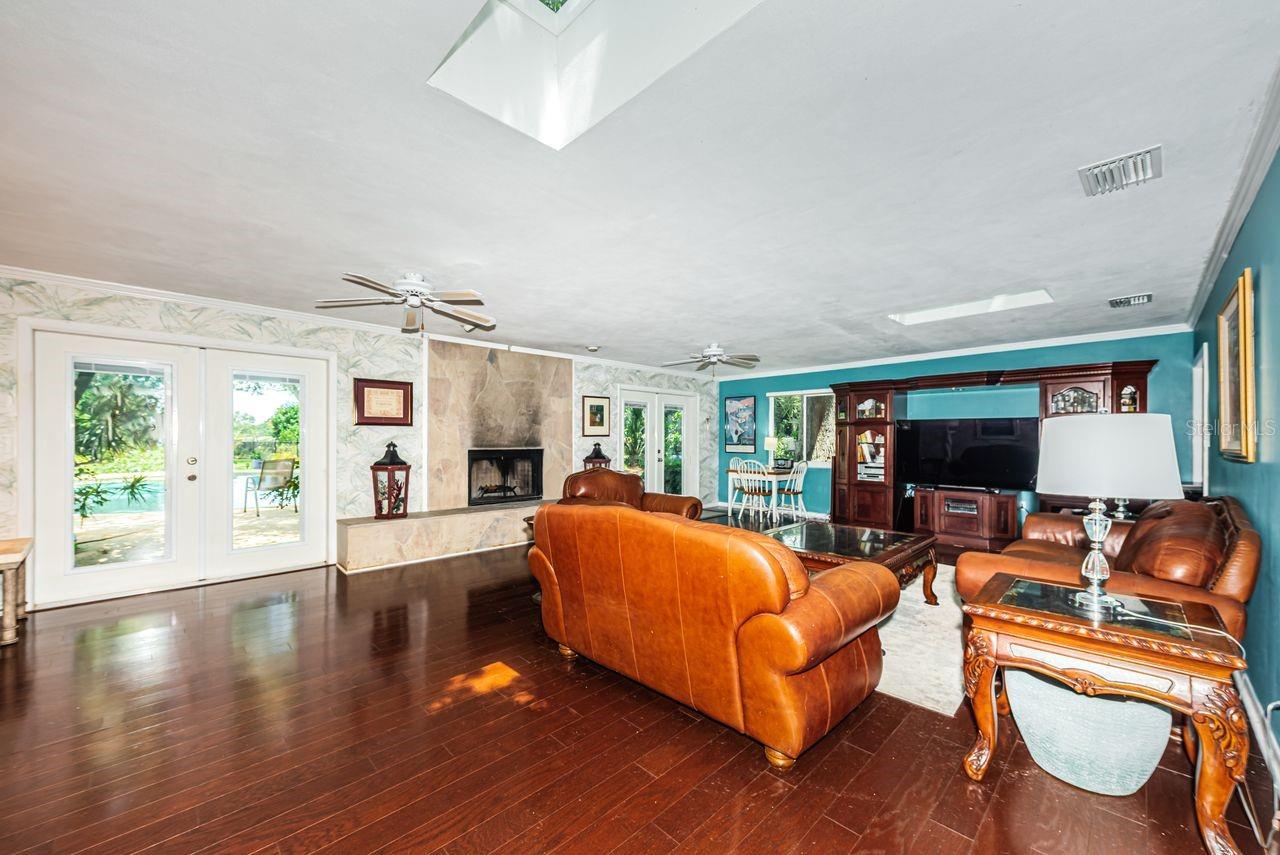 Huge family room with French doors to pool area