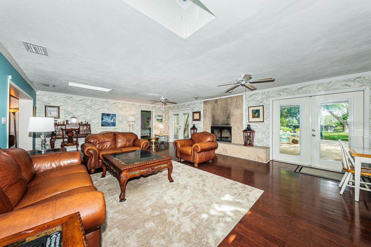 Family room looking out French doors to pool area
