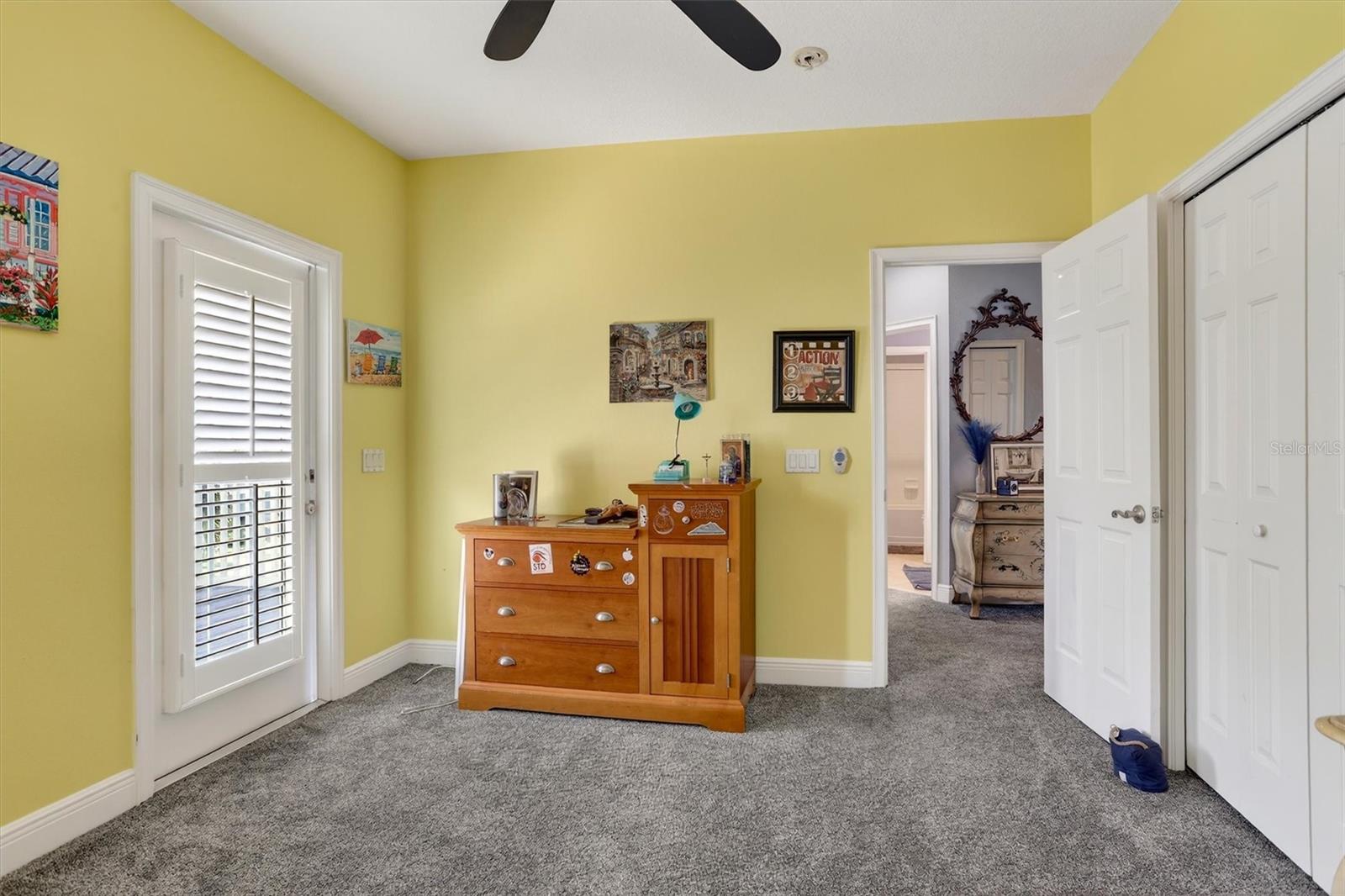 guest bedroom featuring private balcony