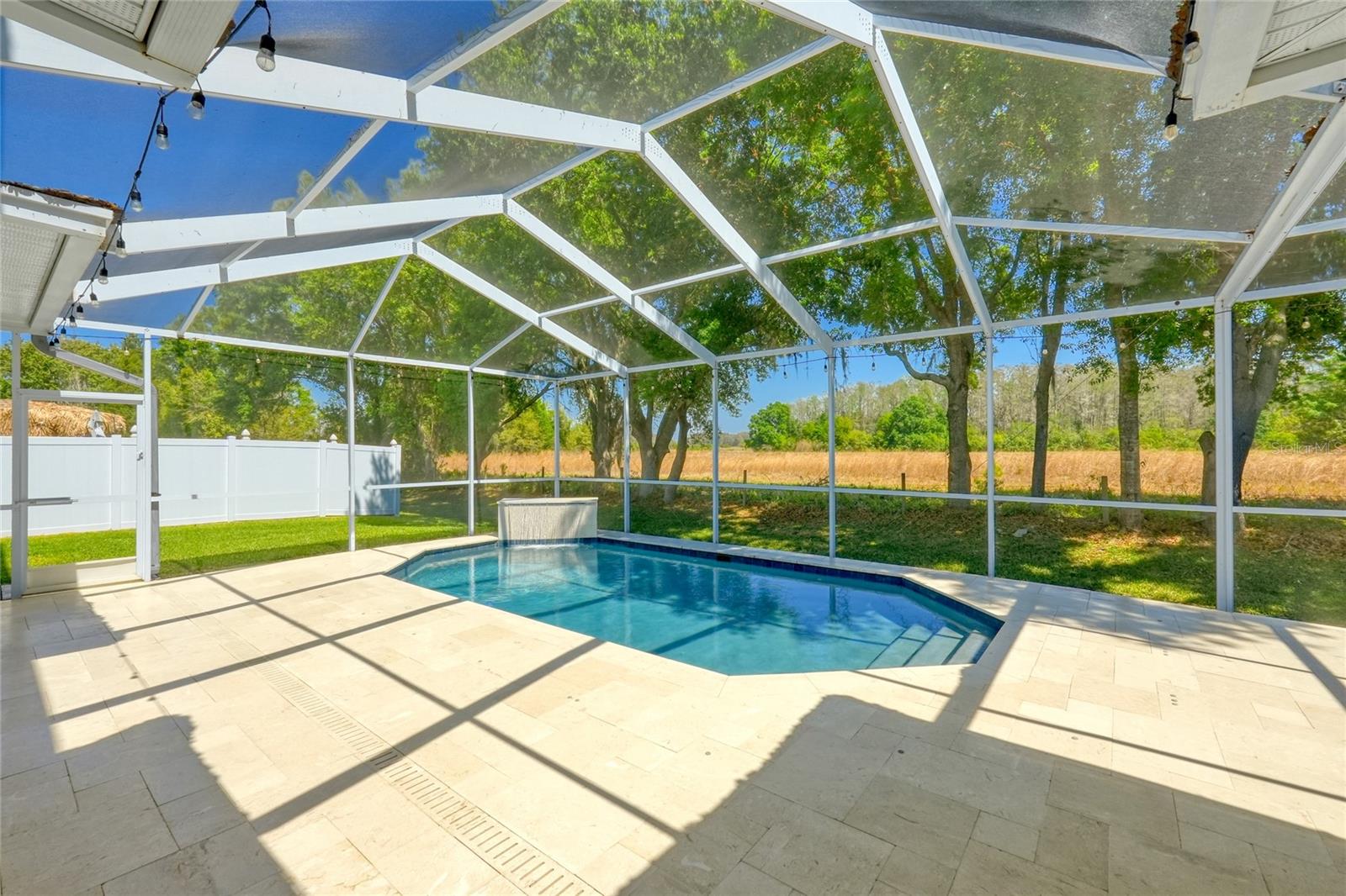 This spacious screened in pool area is perfect for fun in the sun
