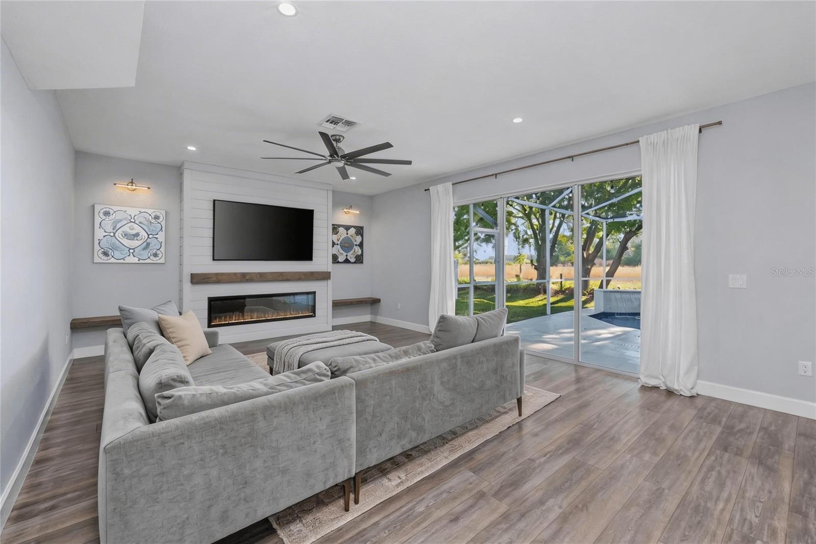 Take in the view of the pool from this spacious Family Room