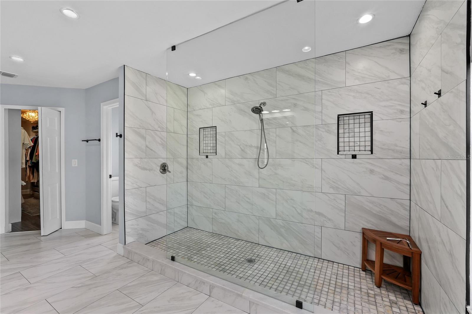 Floor to Ceiling Tiles here as well to keep the designer aesthetic going