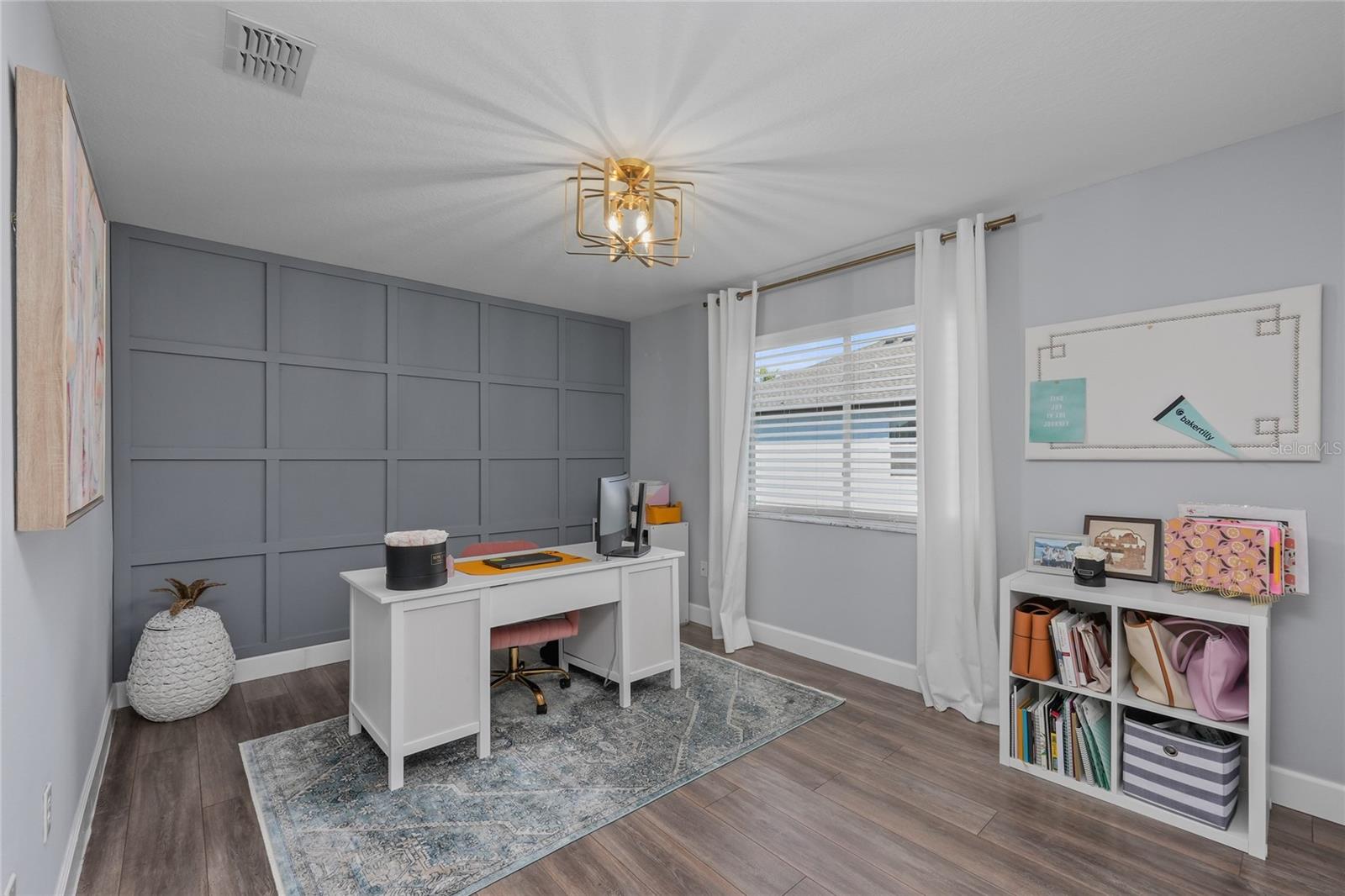 Bedroom 5 with a custom wood accent wall