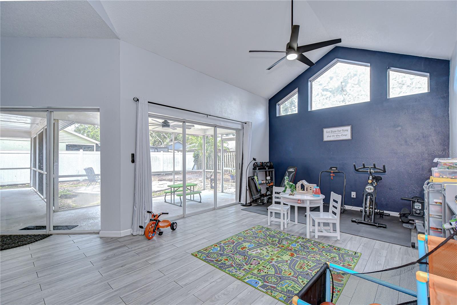 Breakfast nook with cathedral ceilings and yard views.