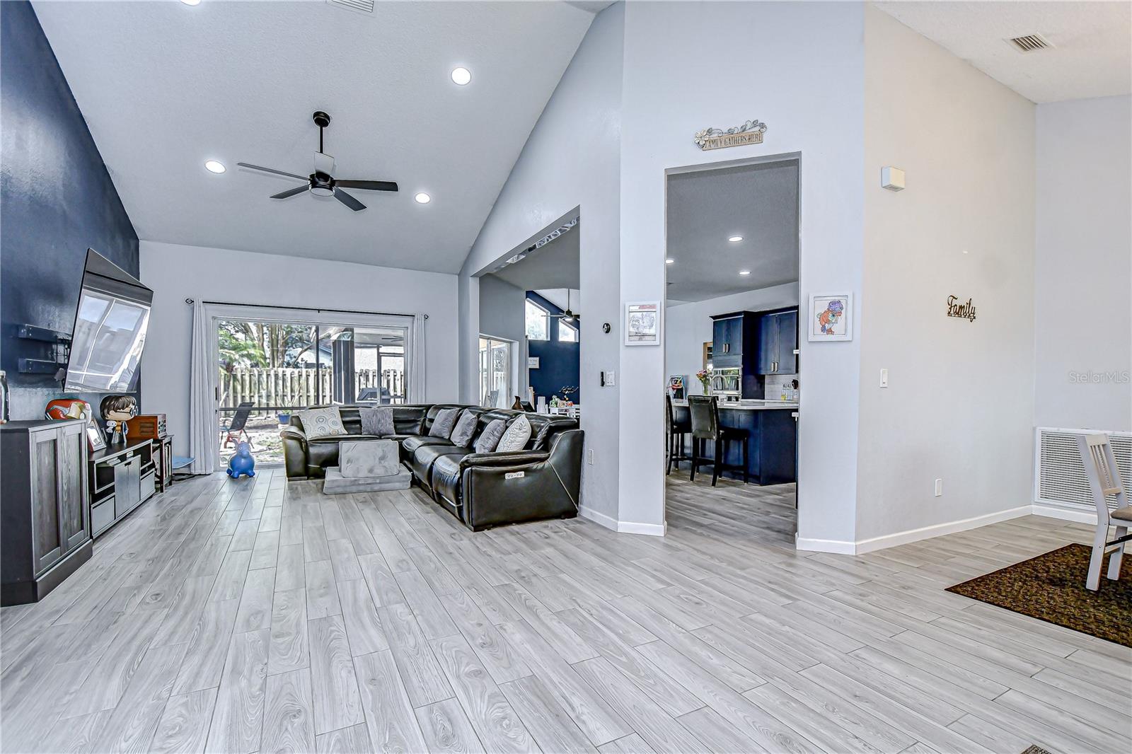 Vaulted ceilings frame the great room with sliders.