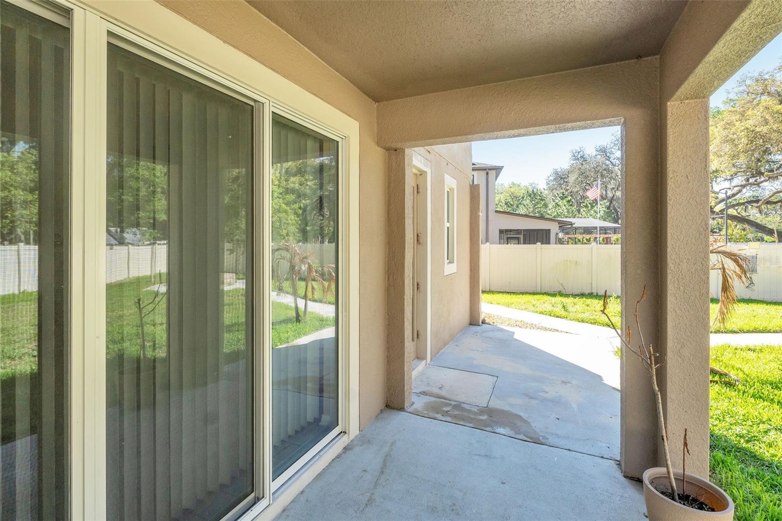 Back porch with view of large sliders