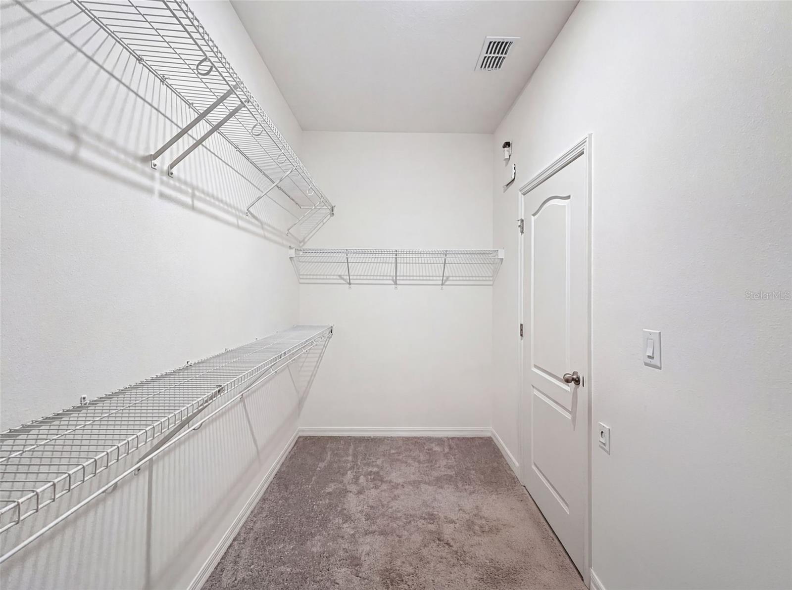 Well-designed closet with abundant hanging and storage space