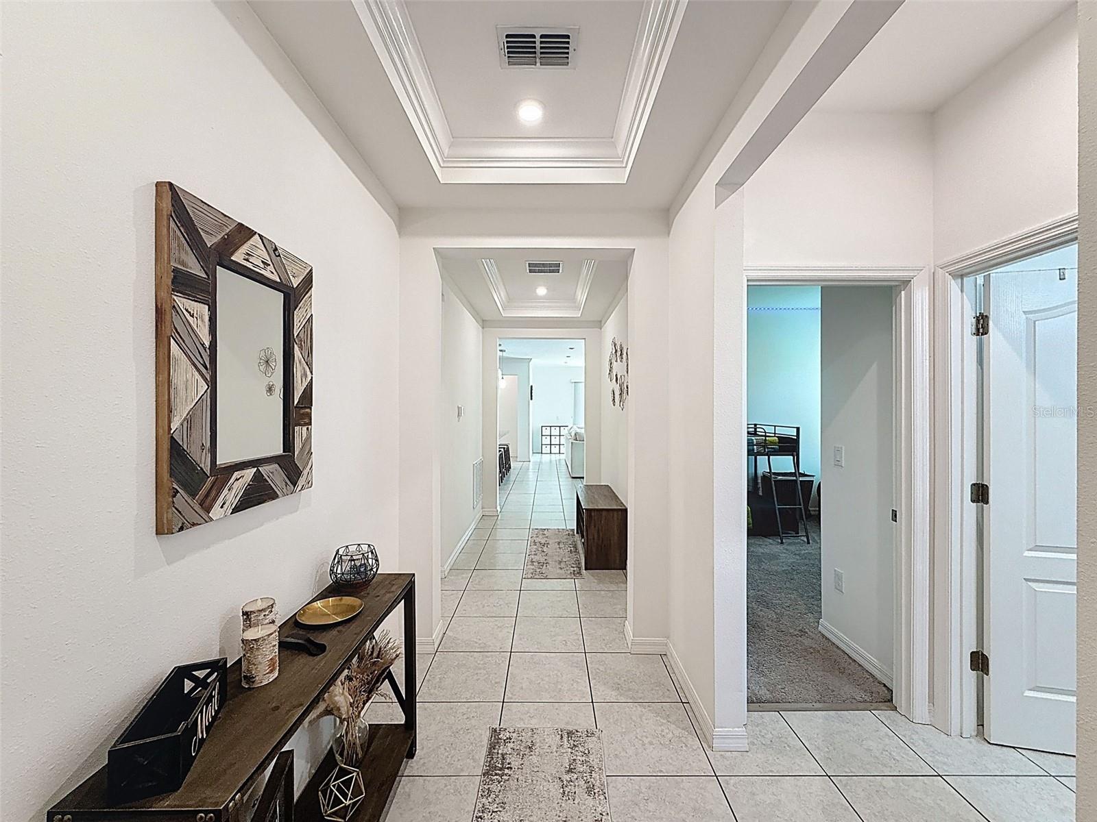 Elegant tray ceilings welcome you at entry