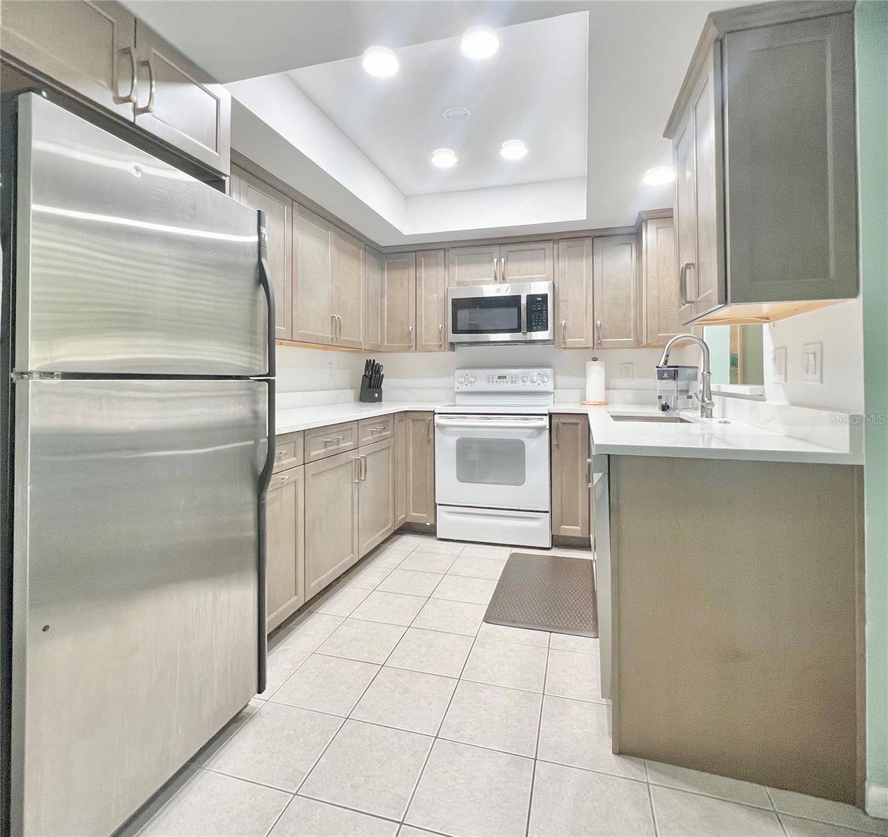 Updated Kitchen with new countertops and cabinets.