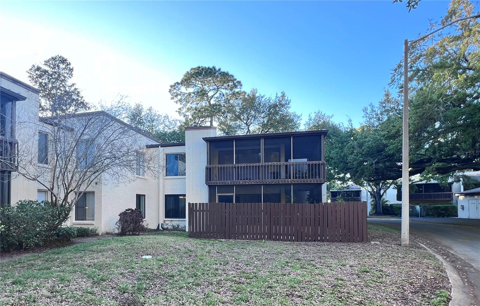 Outside of building. bottom floor is 814 behind the wood fence