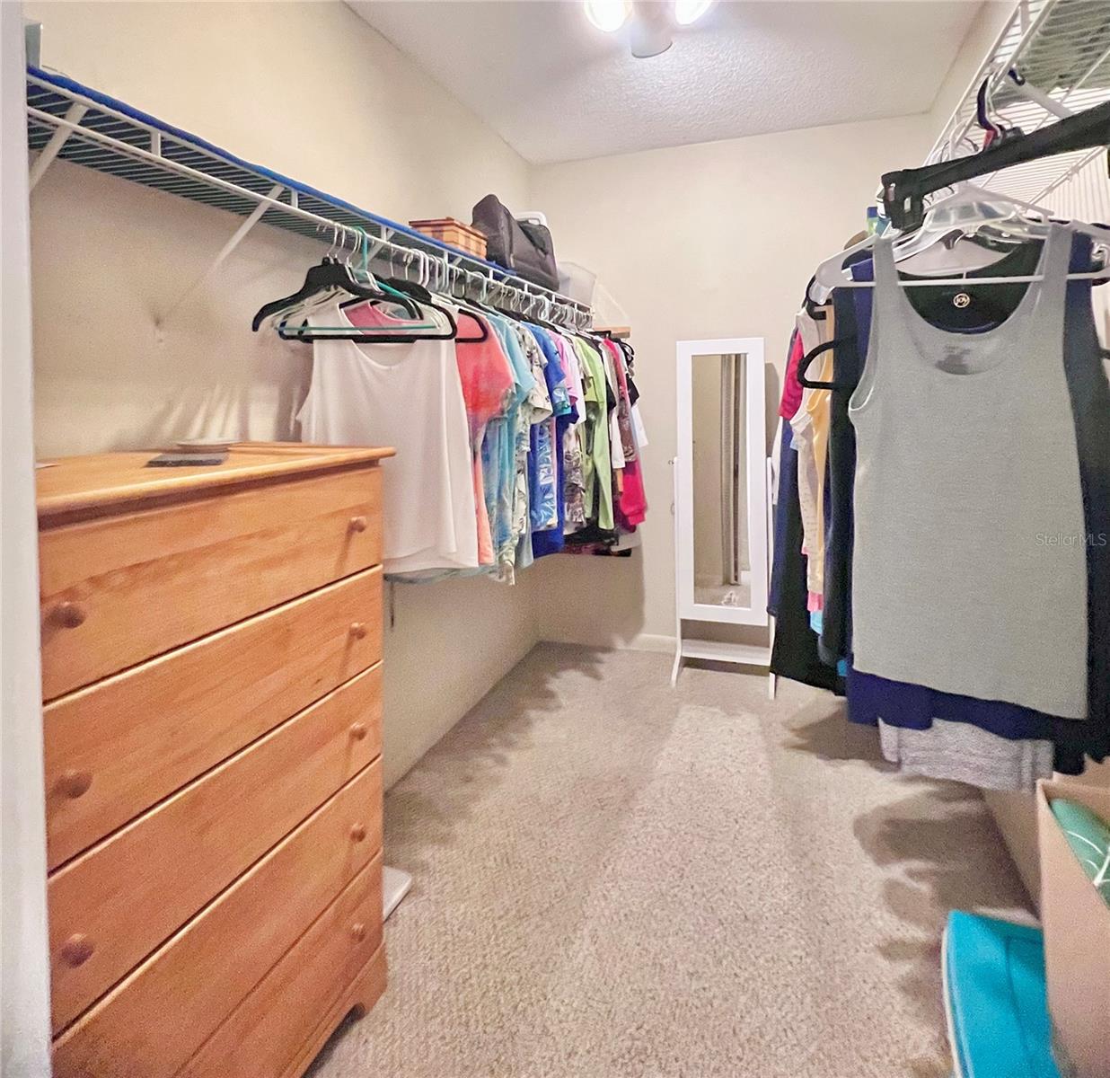 Large walk-in closet in primary bedroom