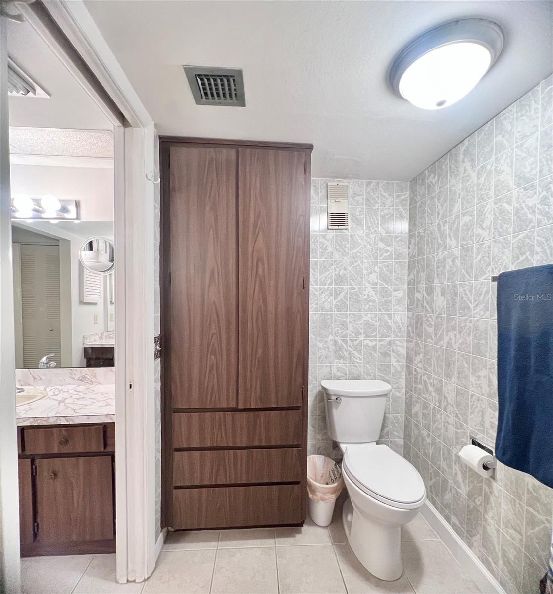 Primary bathroom has seperate shower toilet area with pocket door