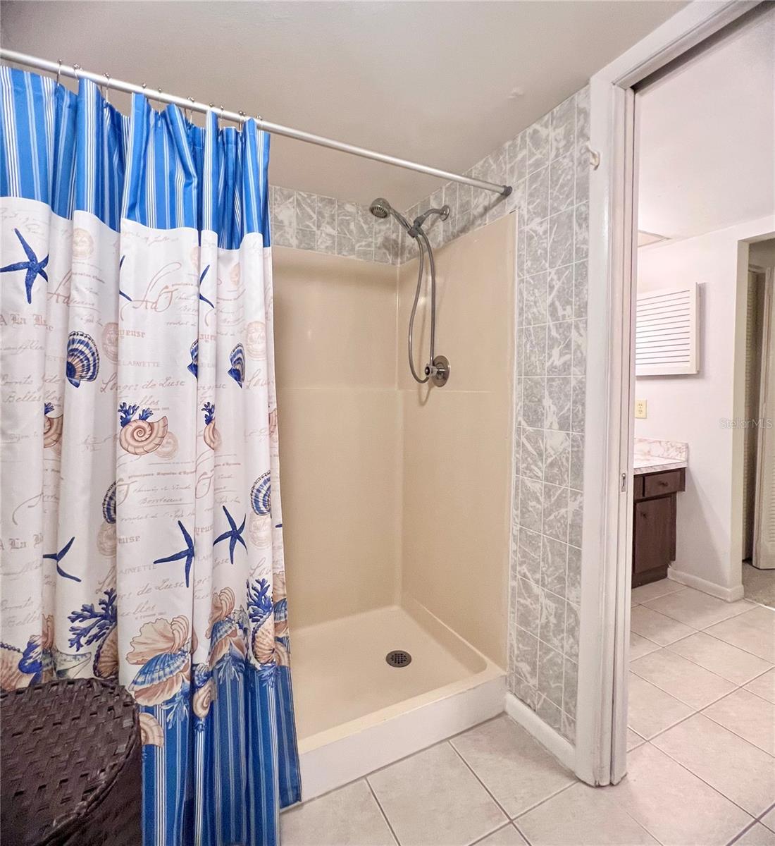 full size shower with pocket door