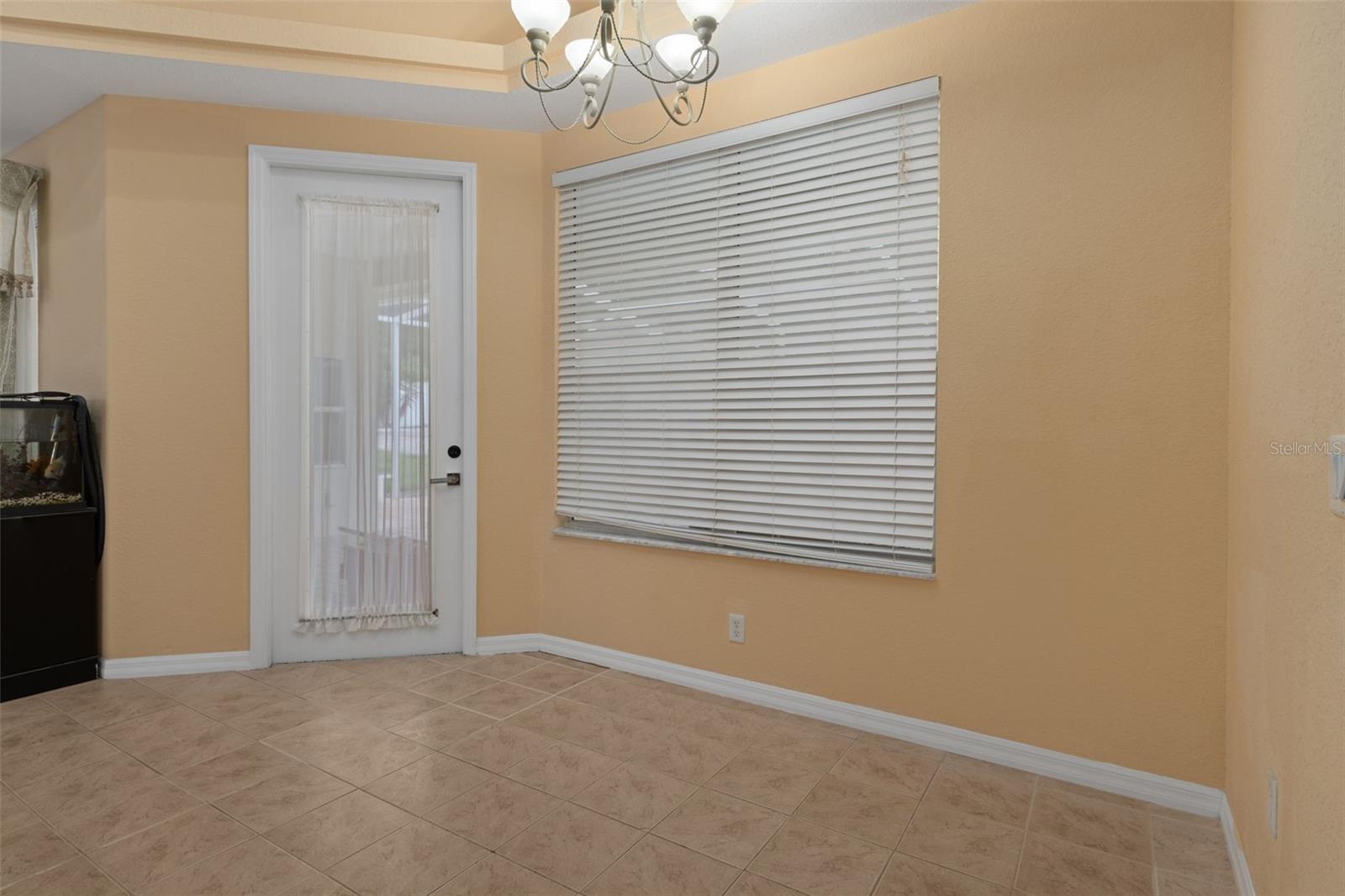 Breakfast nook with bay windows overlooking the gorgeous pool and jacuzzi