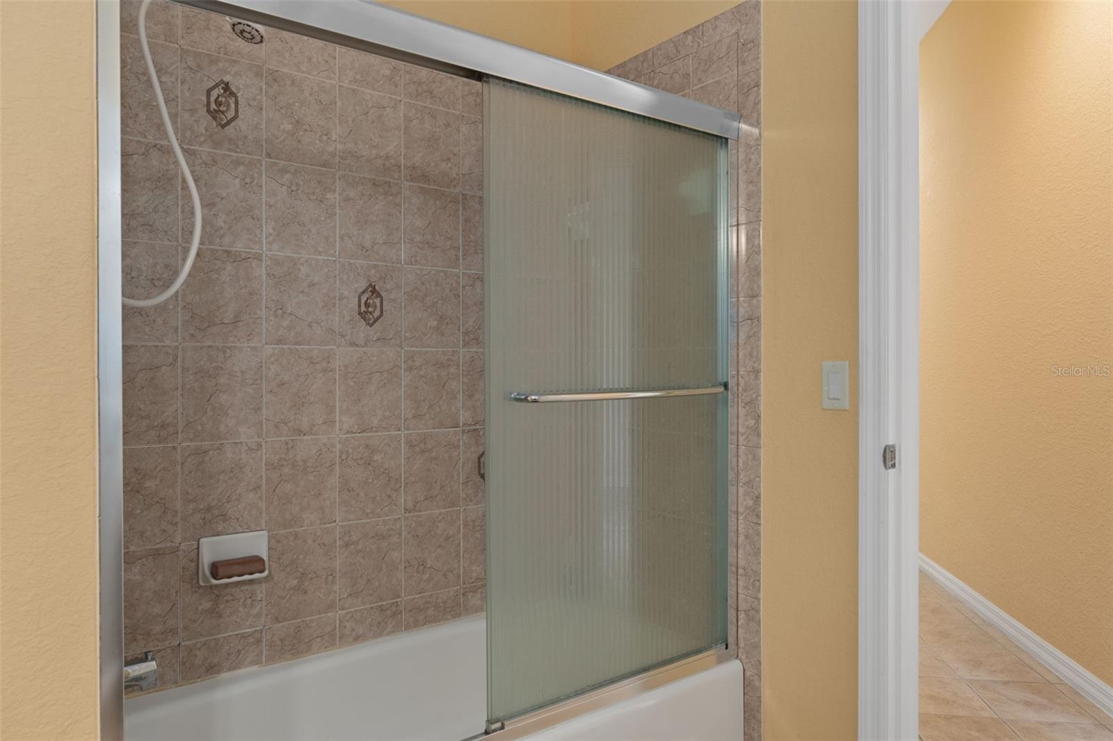 There is a Tub/Shower  Combo in the Pool Bathroom that is Beautifully Tiled