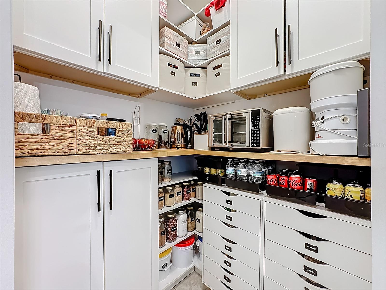 Walk-in pantry with custom shelving & organized storage