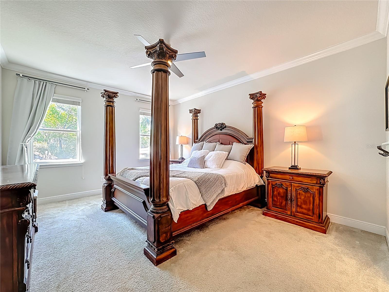 Spacious primary suite featuring en-suite bathroom & oversized custom walk-in closet