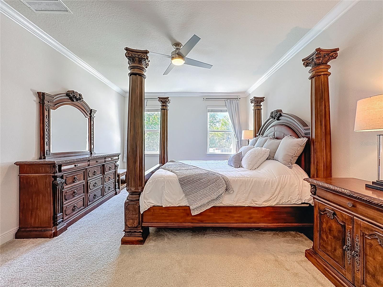 Spacious primary suite featuring en-suite bathroom & oversized custom walk-in closet