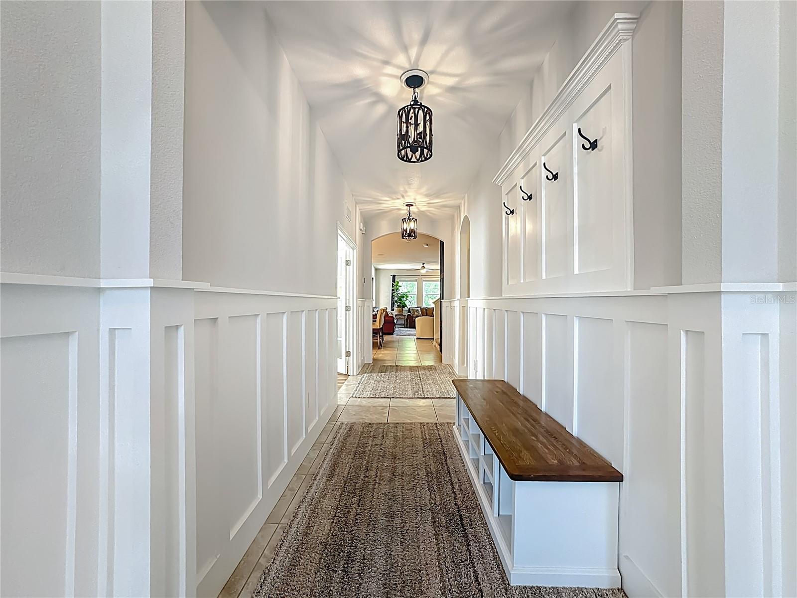 Inviting, captivating entry foyer with custom details