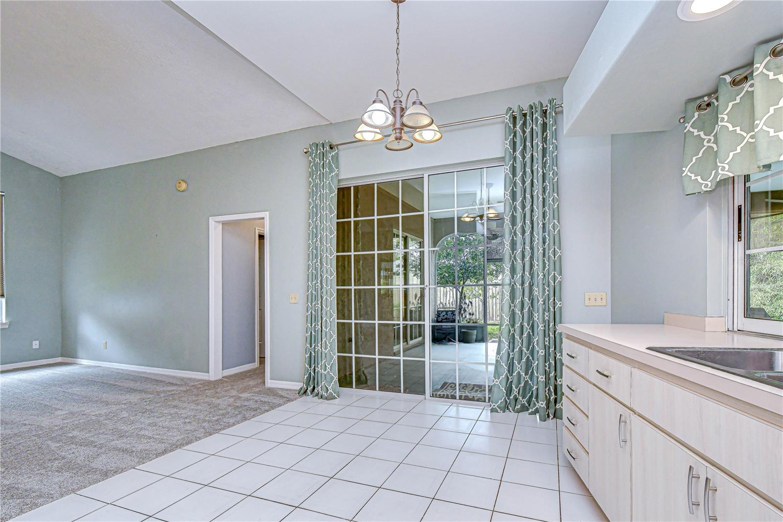 Bright breakfast nook with tile floors.