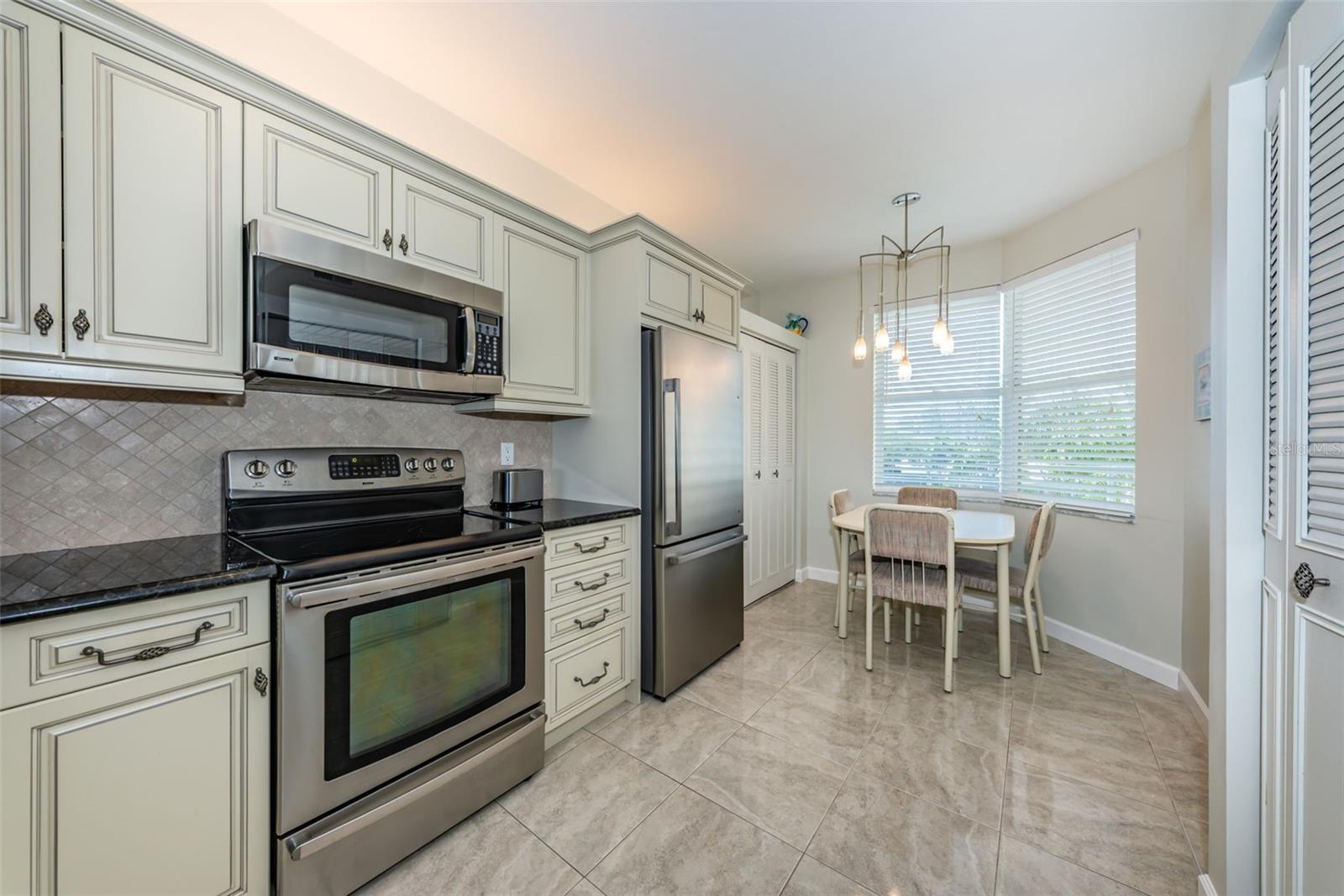 Spacious Eat-In Kitchen with Elegant Cabinetry