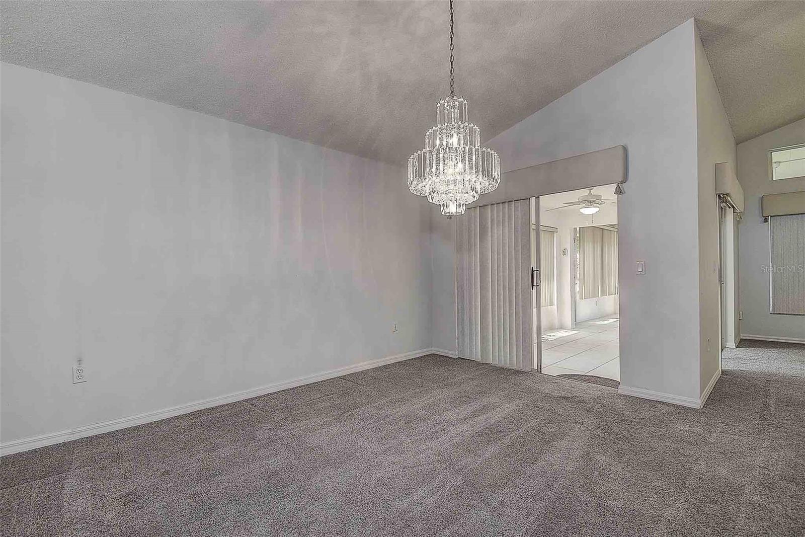 Formal dining room with chandelier.