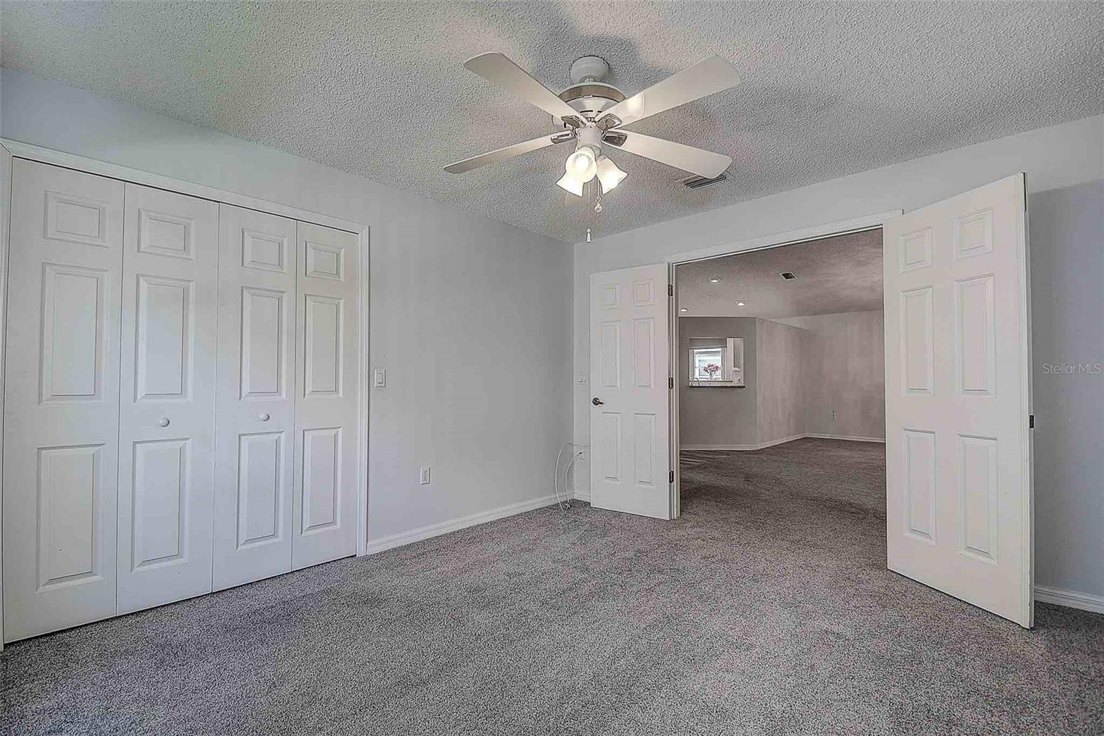 View from third bedroom (office/den) to main living area.
