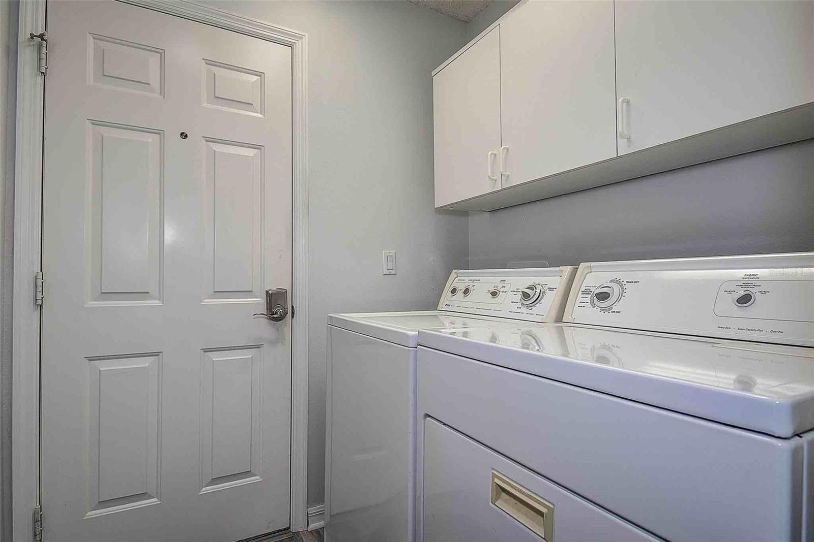 Inside laundry with Kenmore washer and dryer included!
