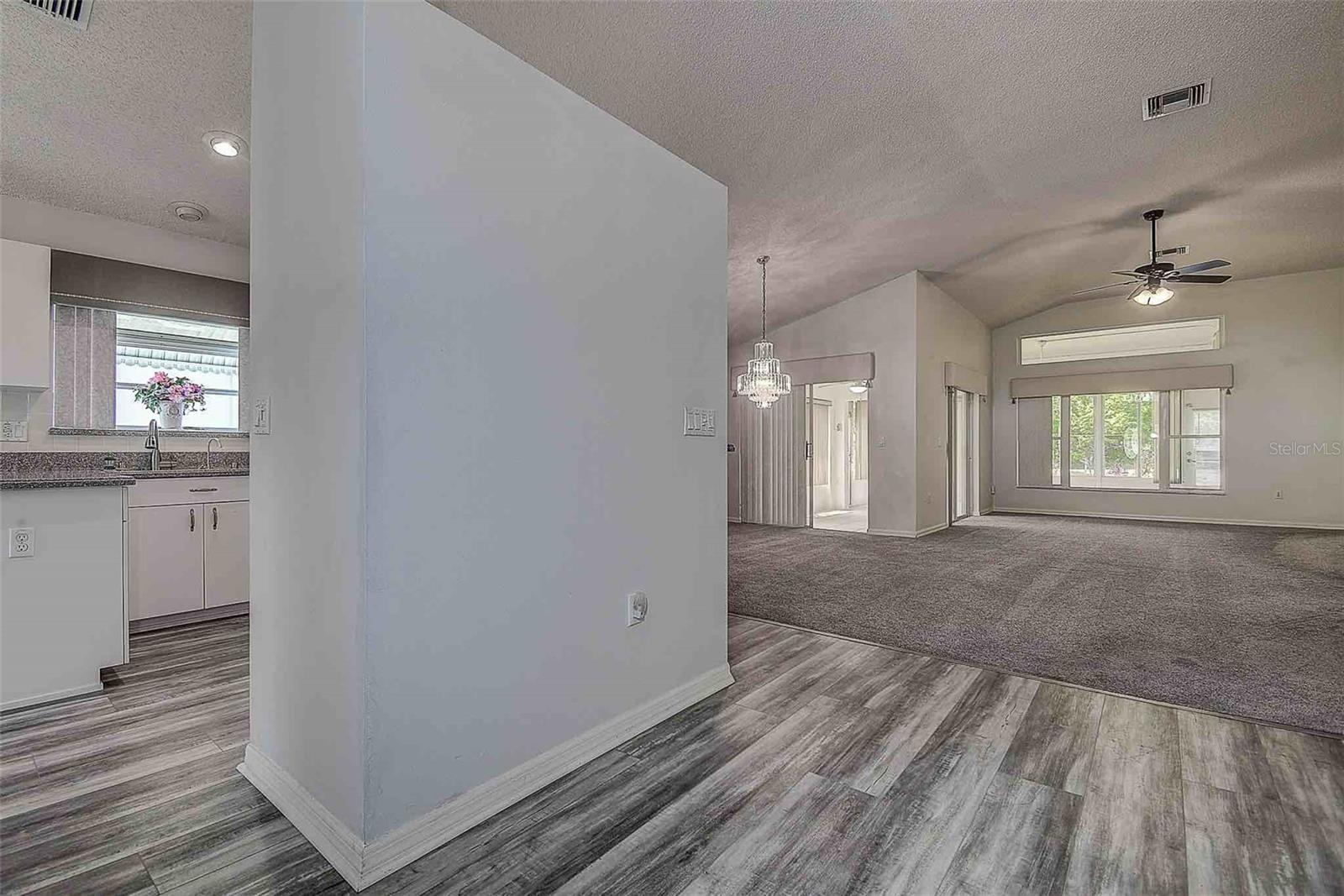 Great room floor plan open to the dining and covered/enclosed Florida room!