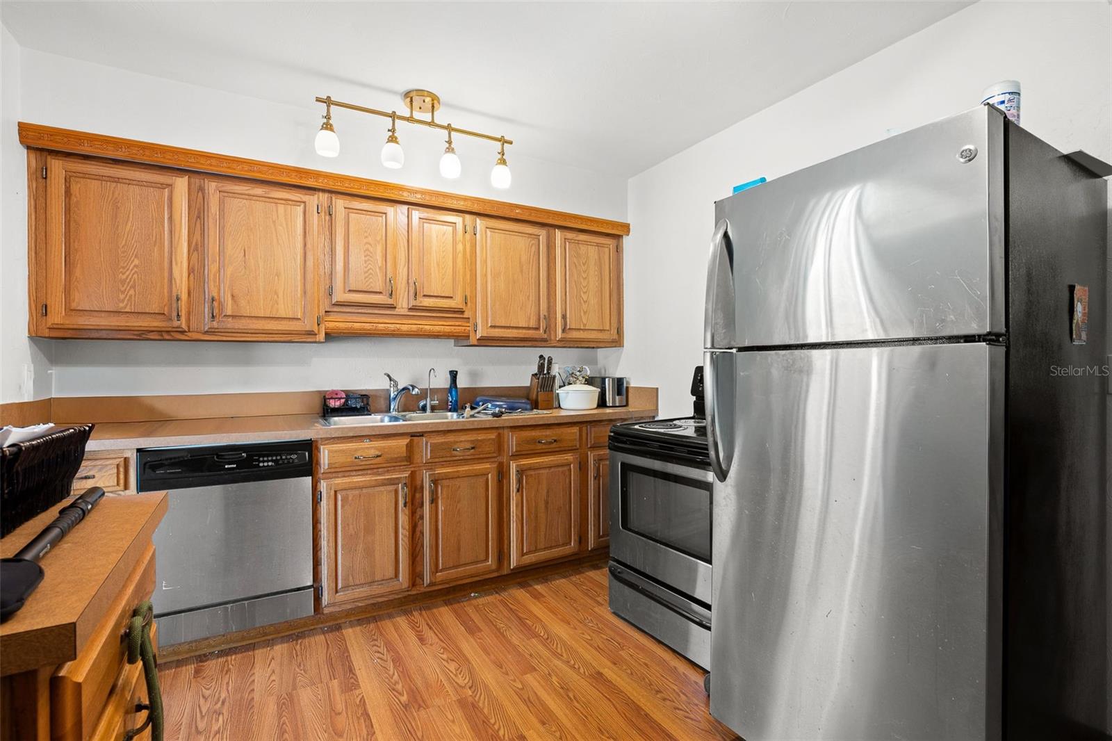 Well-organized kitchen with abundant cabinet storage, extended counter space, and a layout designed for efficient meal prep.