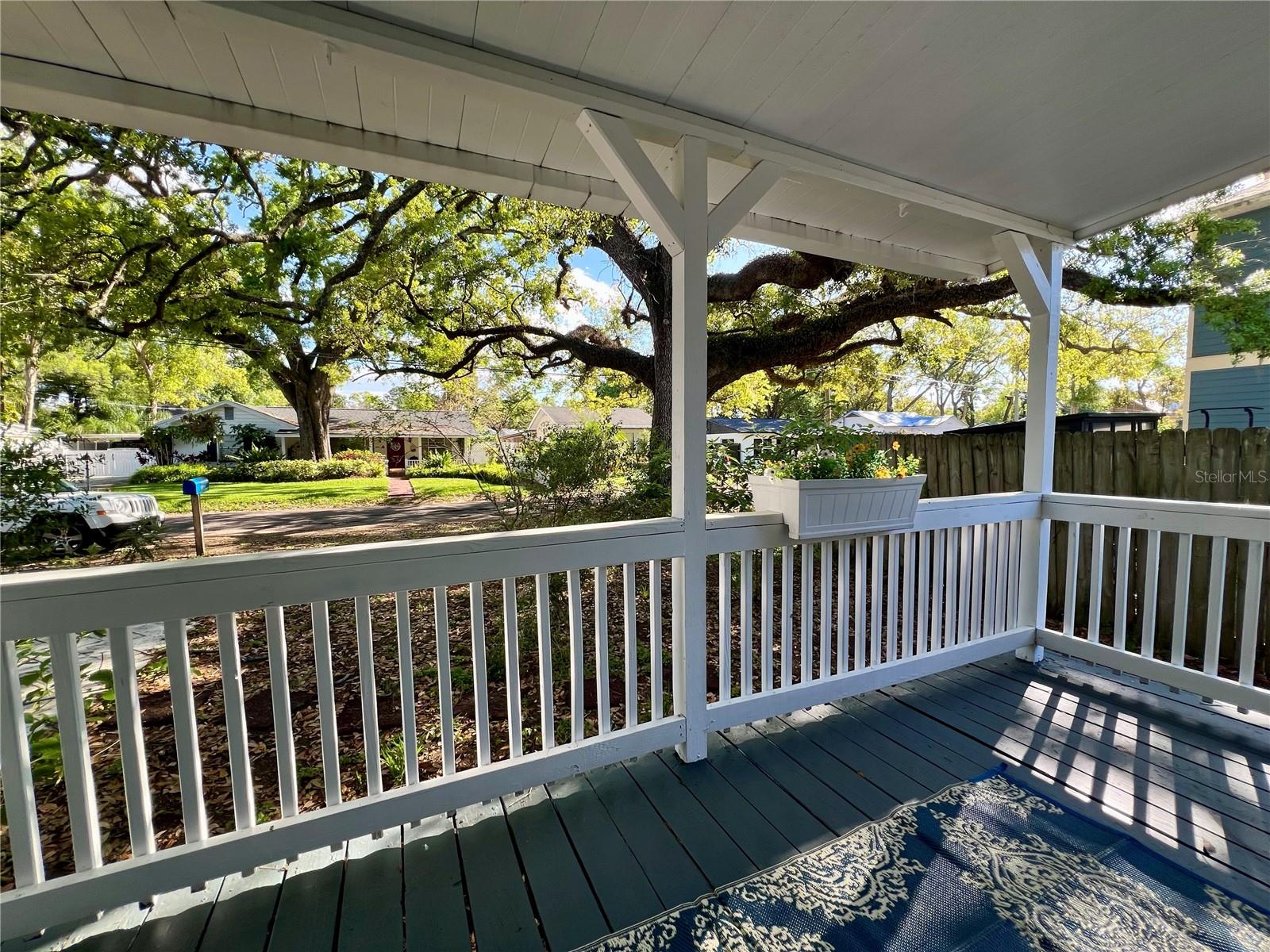 Greet your neighbors from your freshly painted front porch.