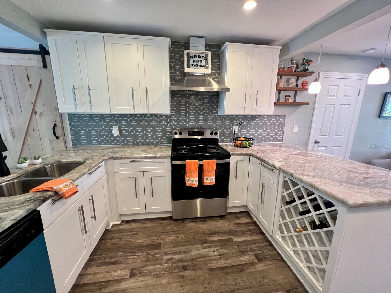 A gleaming kitchen to prepare anything you can dream up with room for your treasured wines