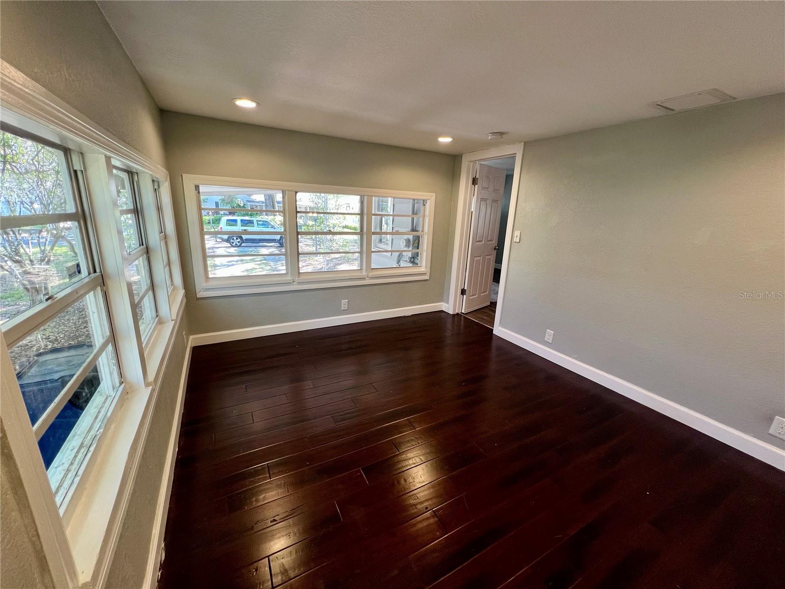 Tons of natural light adorns the bedroom next to the kitchen.