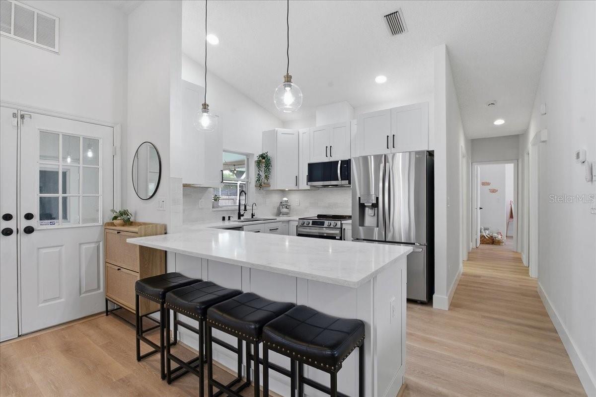 BEAUTIFULLY APPOINTED KITCHEN WITH SOARING CEILINGS