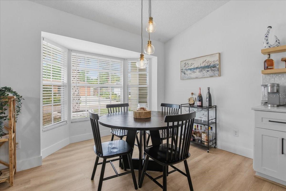 DINING AREA WITH BAY WINDOWS