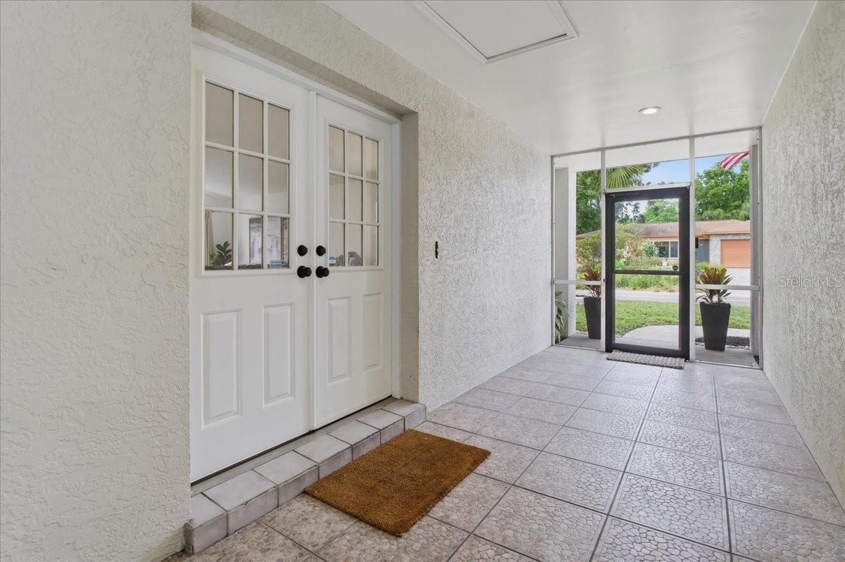BEAUTIFUL DOUBLE DOOR ENTRY IN A COVERED BREEZEWAY