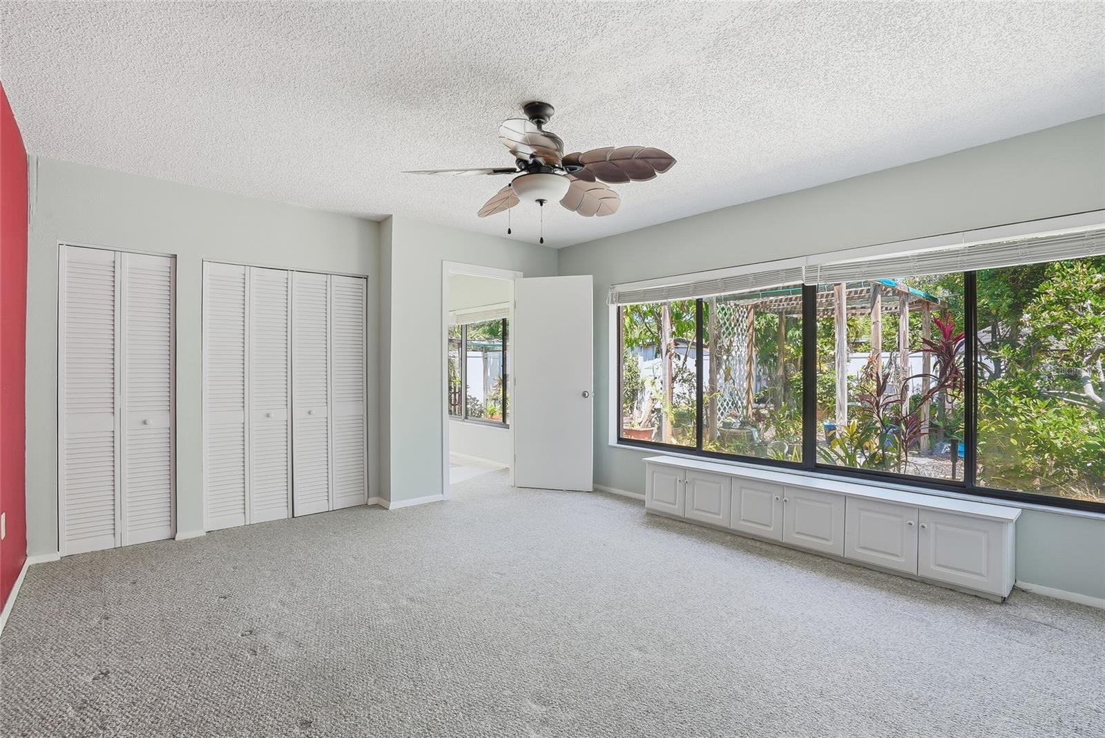 Second bedroom with relaxing patio views.