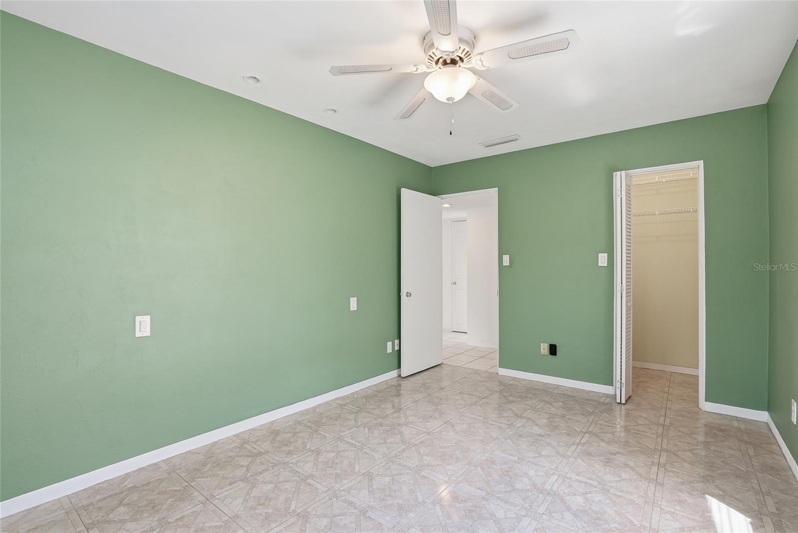 Primary bedroom with spacious walk-in closet.