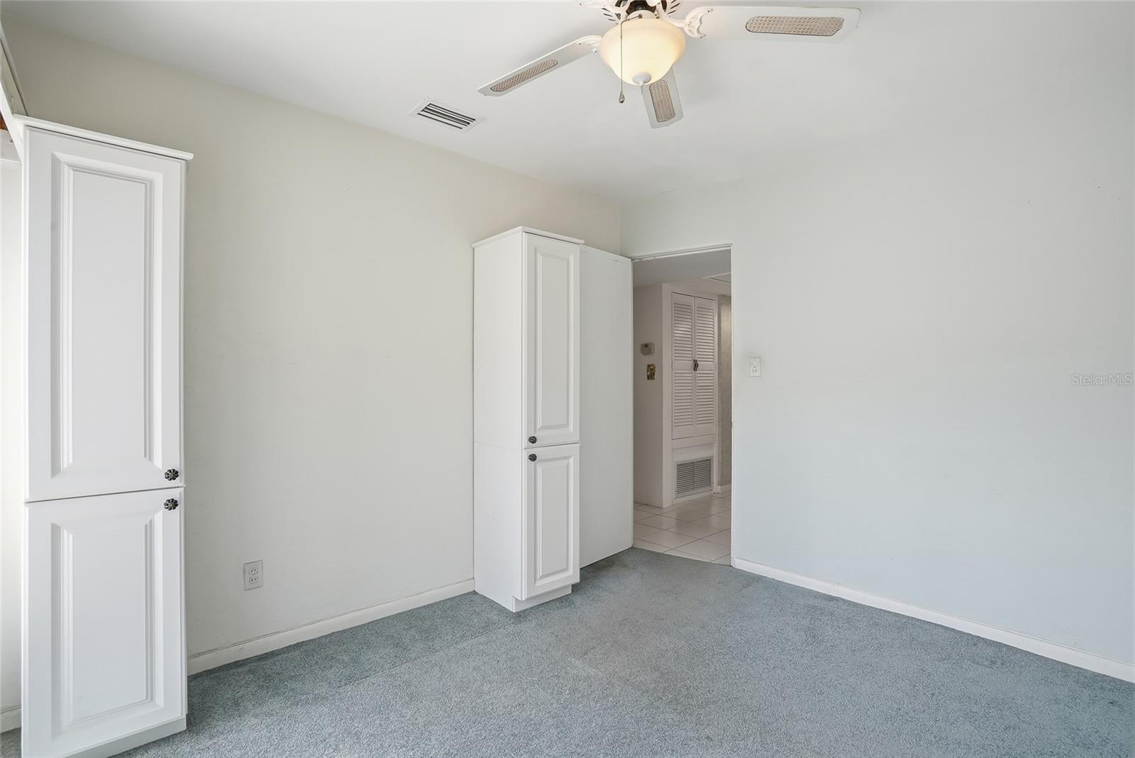 Third bedroom includes built-in closet cabinets for extra storage.