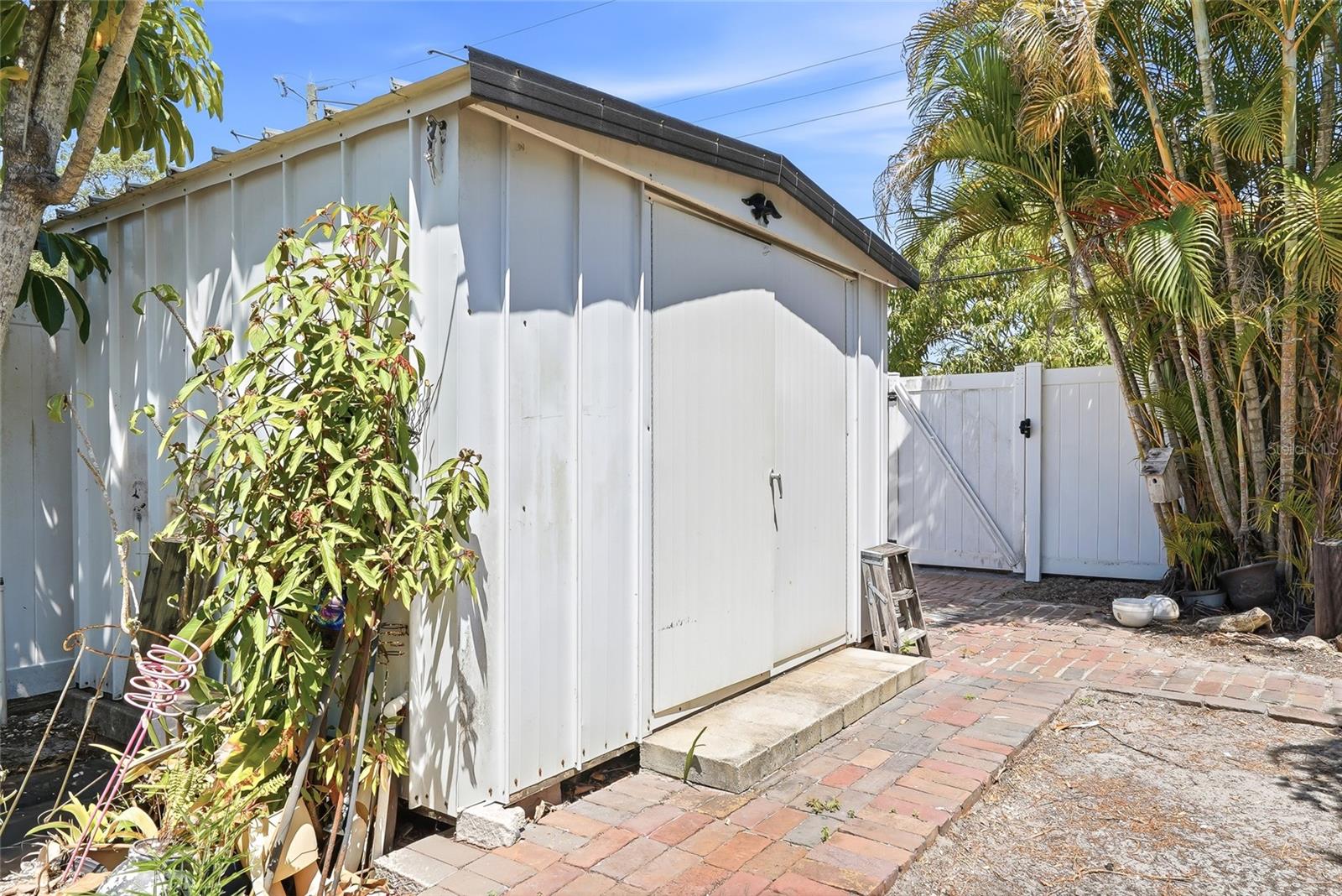 Storage shed already installed, perfect for tools, bikes, and outdoor essentials.