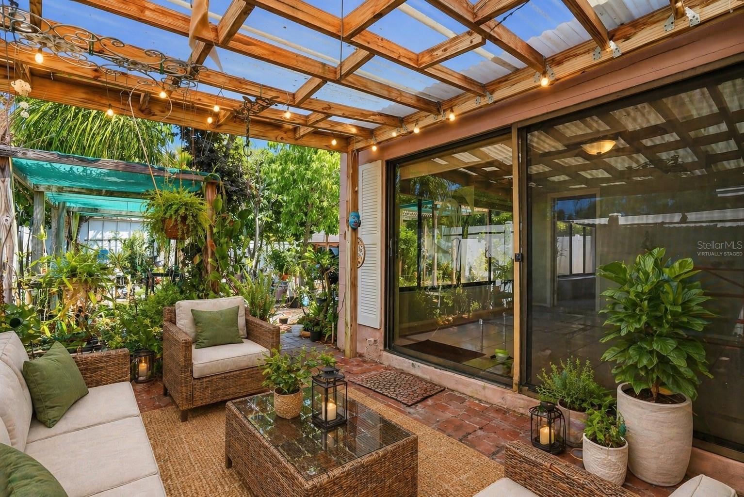 Covered patio, the perfect spot for your morning coffee, plants, or quiet evenings outdoors. Virtually Staged