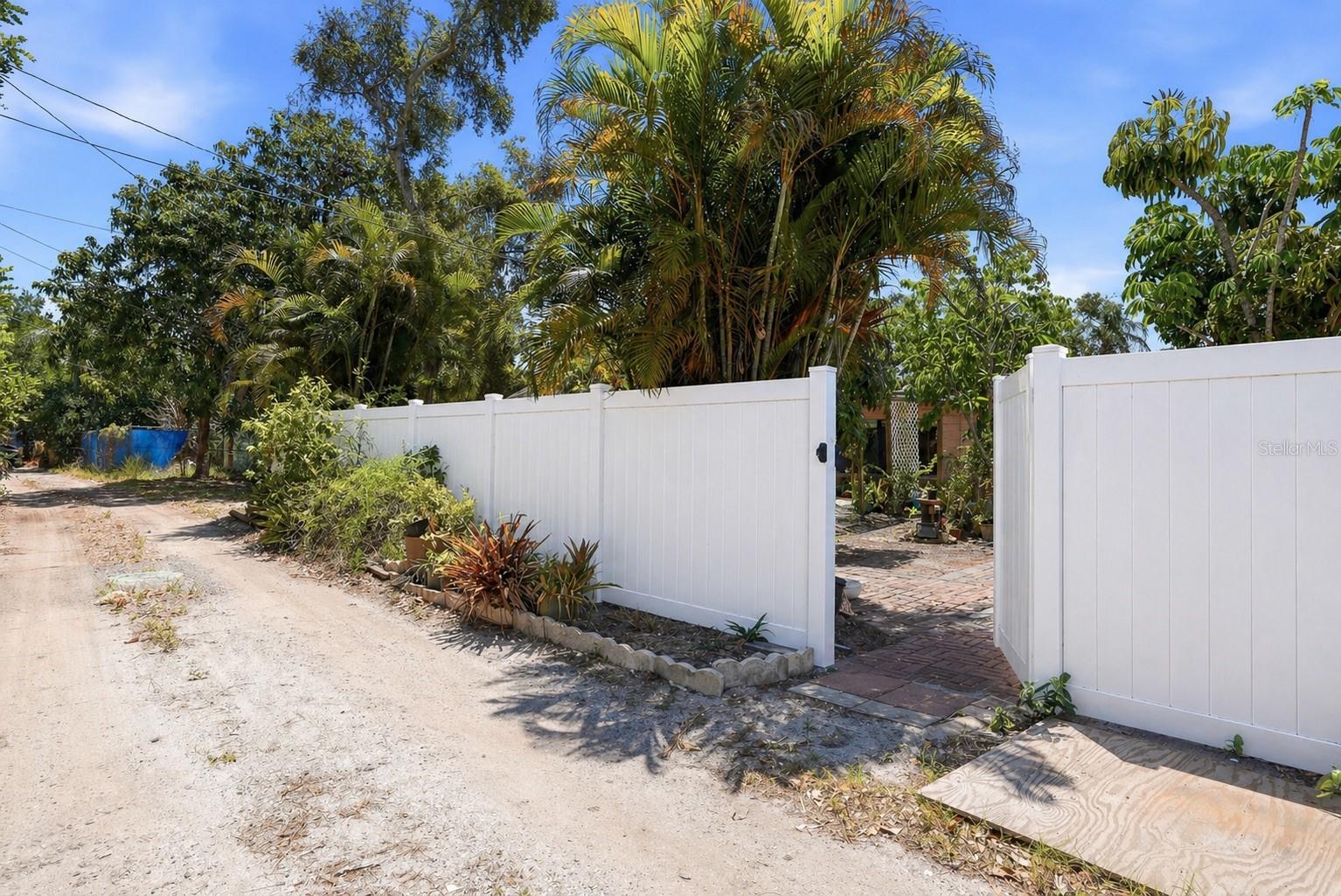 Alley access adds convenience, and the fully fenced white vinyl yard offers privacy and space to enjoy. Virtually enhanced