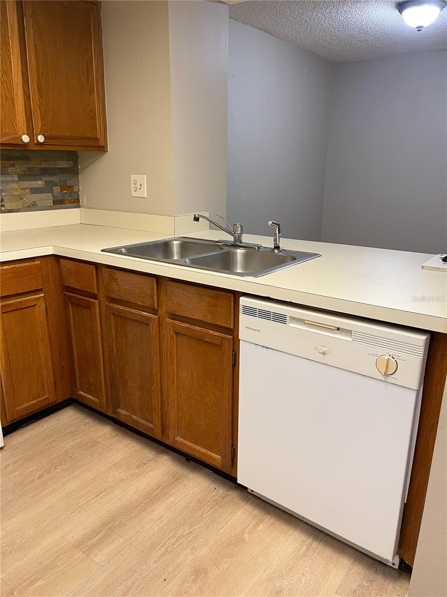 Micro bacterial growth present under sink and some cabinets. Please be careful