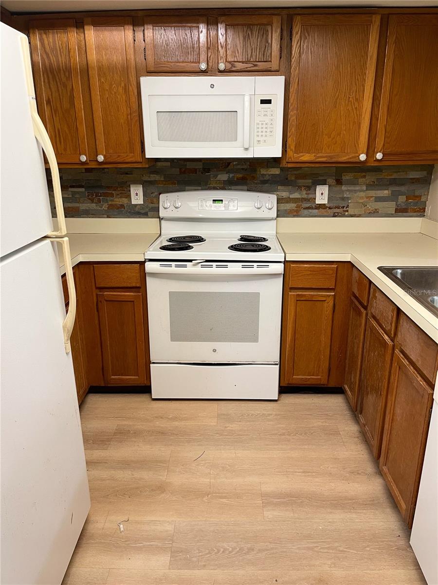 Micro bacterial growth present under sink and some cabinets. Please be careful