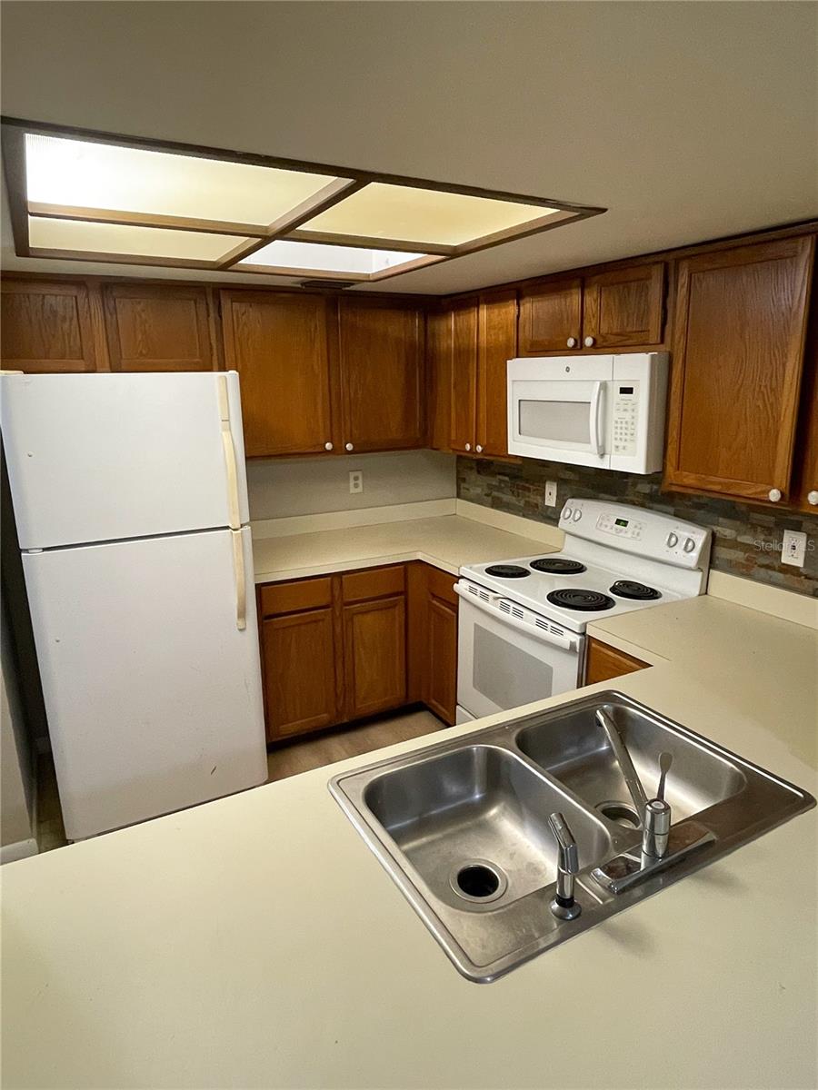 Micro bacterial growth present under sink and some cabinets. Please be careful