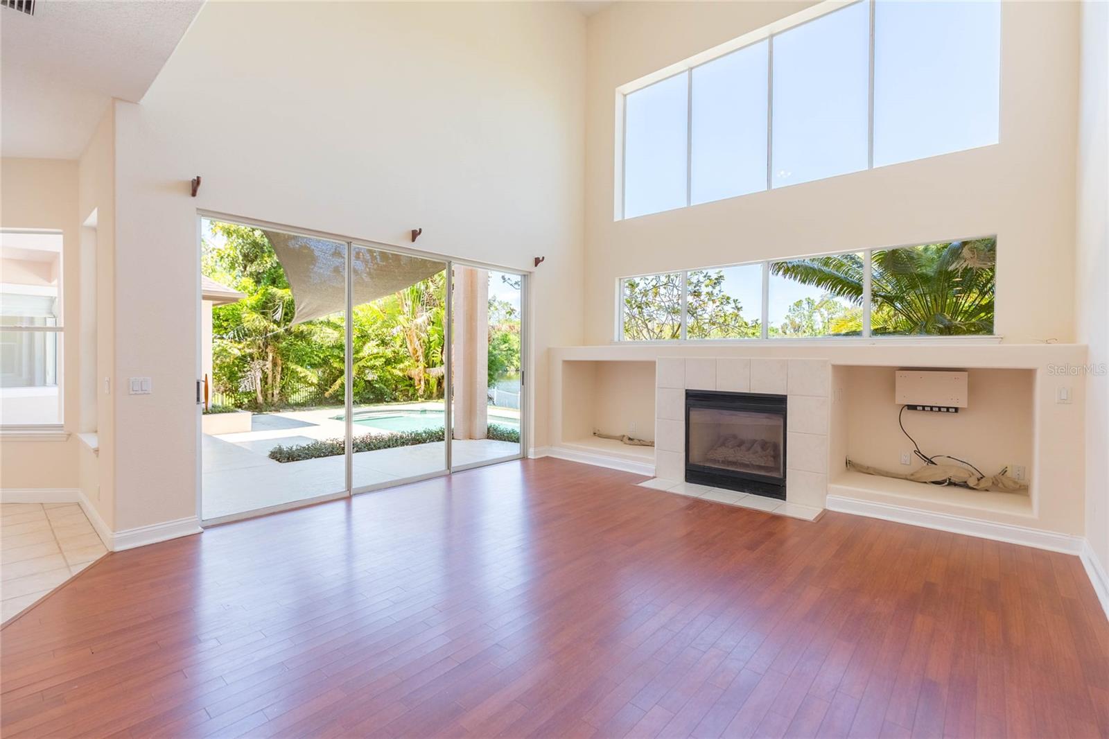 Triple sliders to the pool and fully landscaped and private back yard