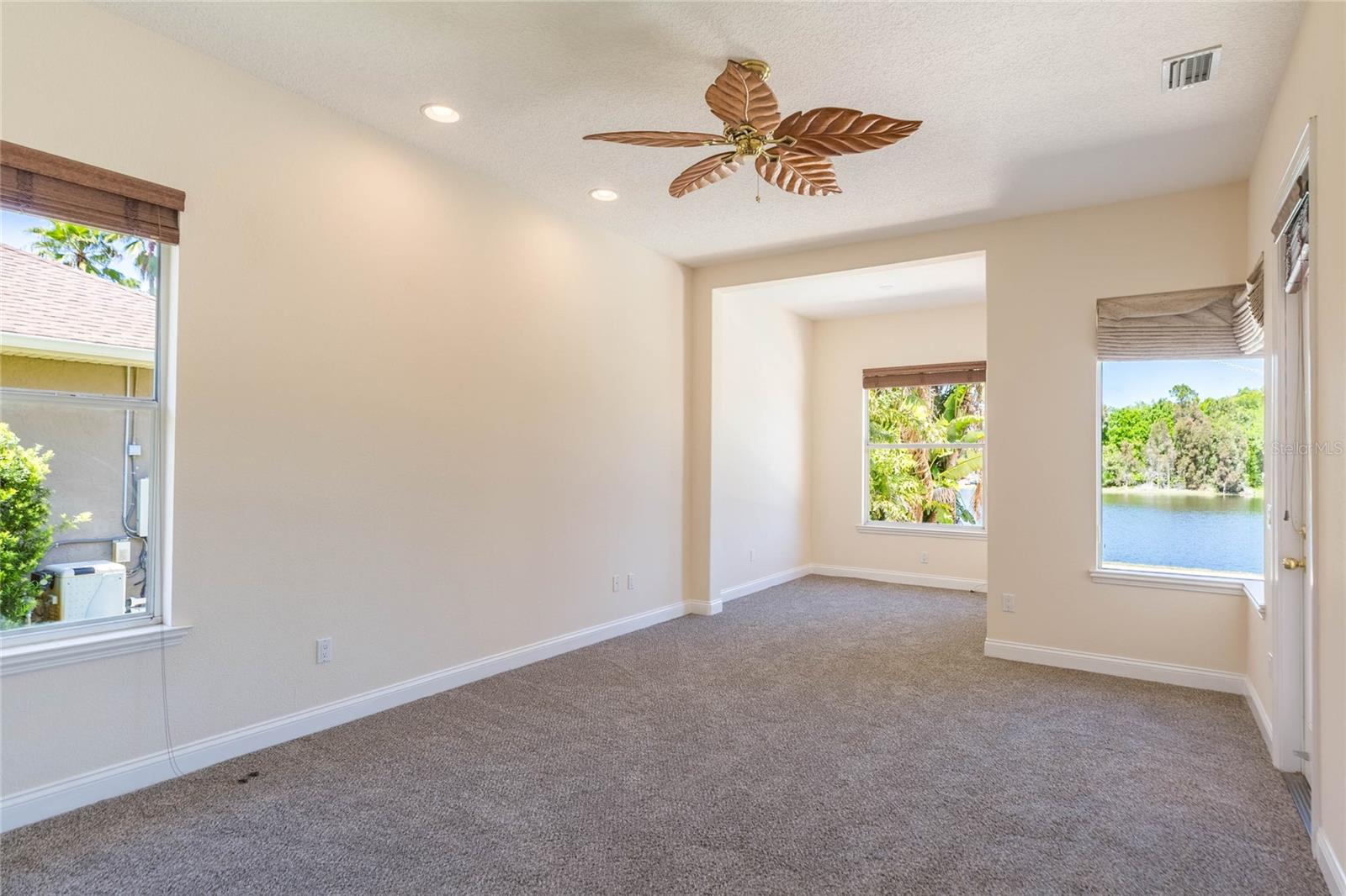Primary bedroom includes separate area for lounging and enjoying the view