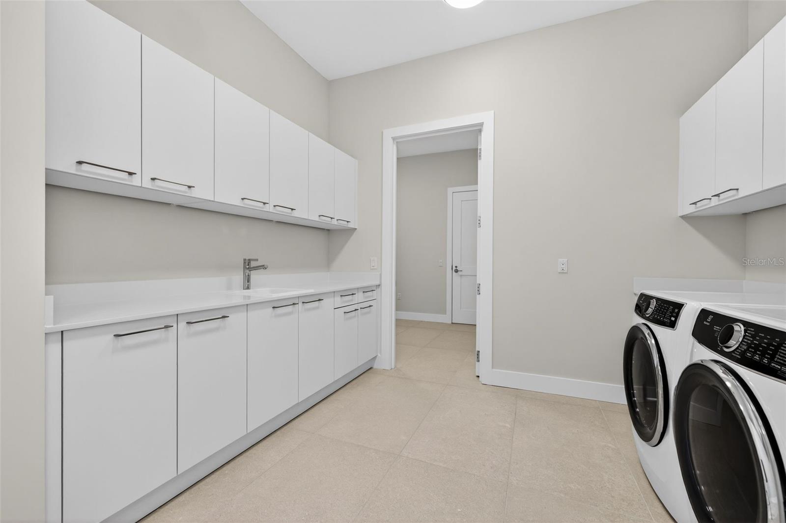 Laundry Room W/ Additional Mud Room and Access to Hall