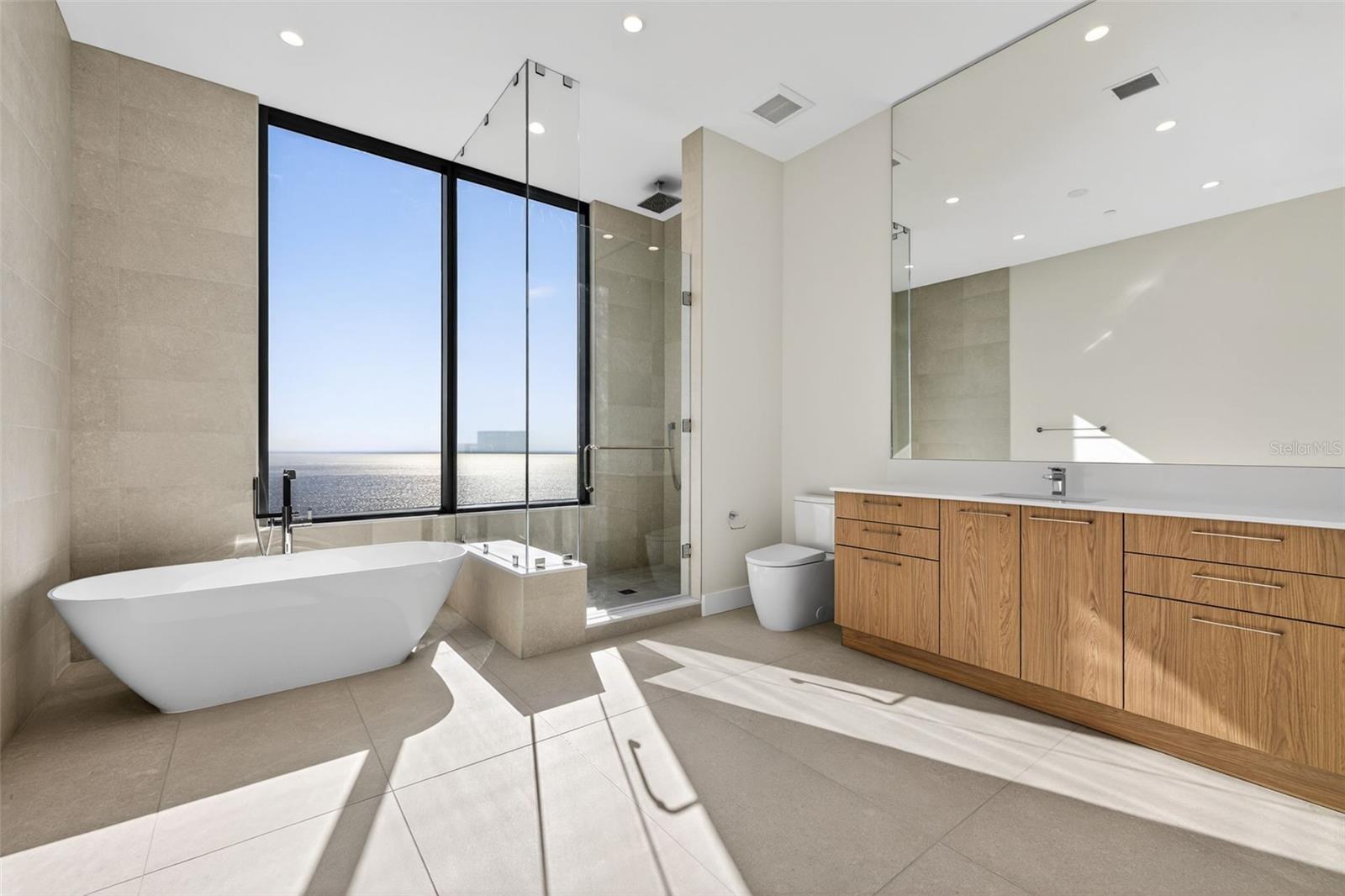 Primary Suite Bathroom W/ Soaking Tub and East Facing Views